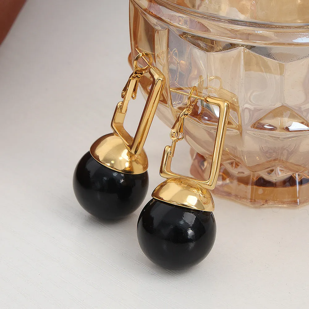 Extravagant Titanium Steel Earrings with Gold-Plated Bead Pendant